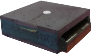 A picture of a planar transformers. It looks like a black box.